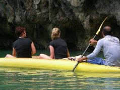 women sitting in a boat