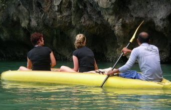 women sitting in a boat