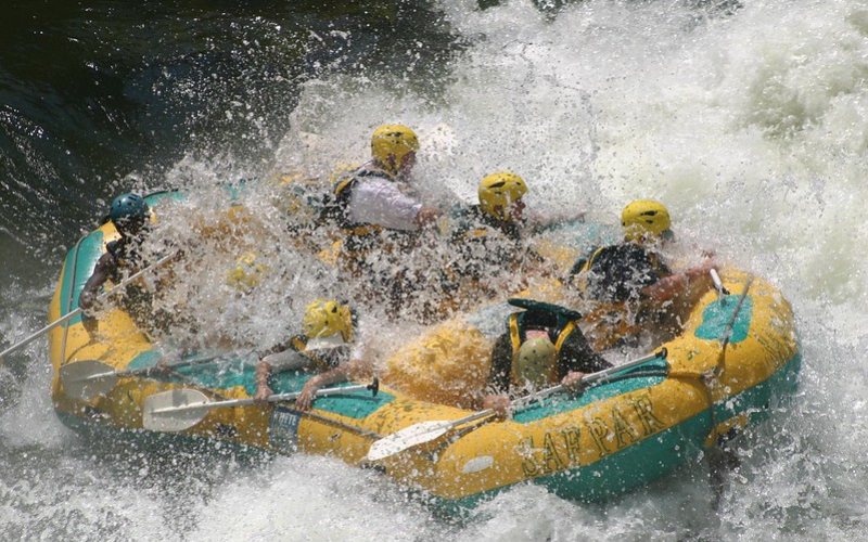 tourist enjoying river rafting